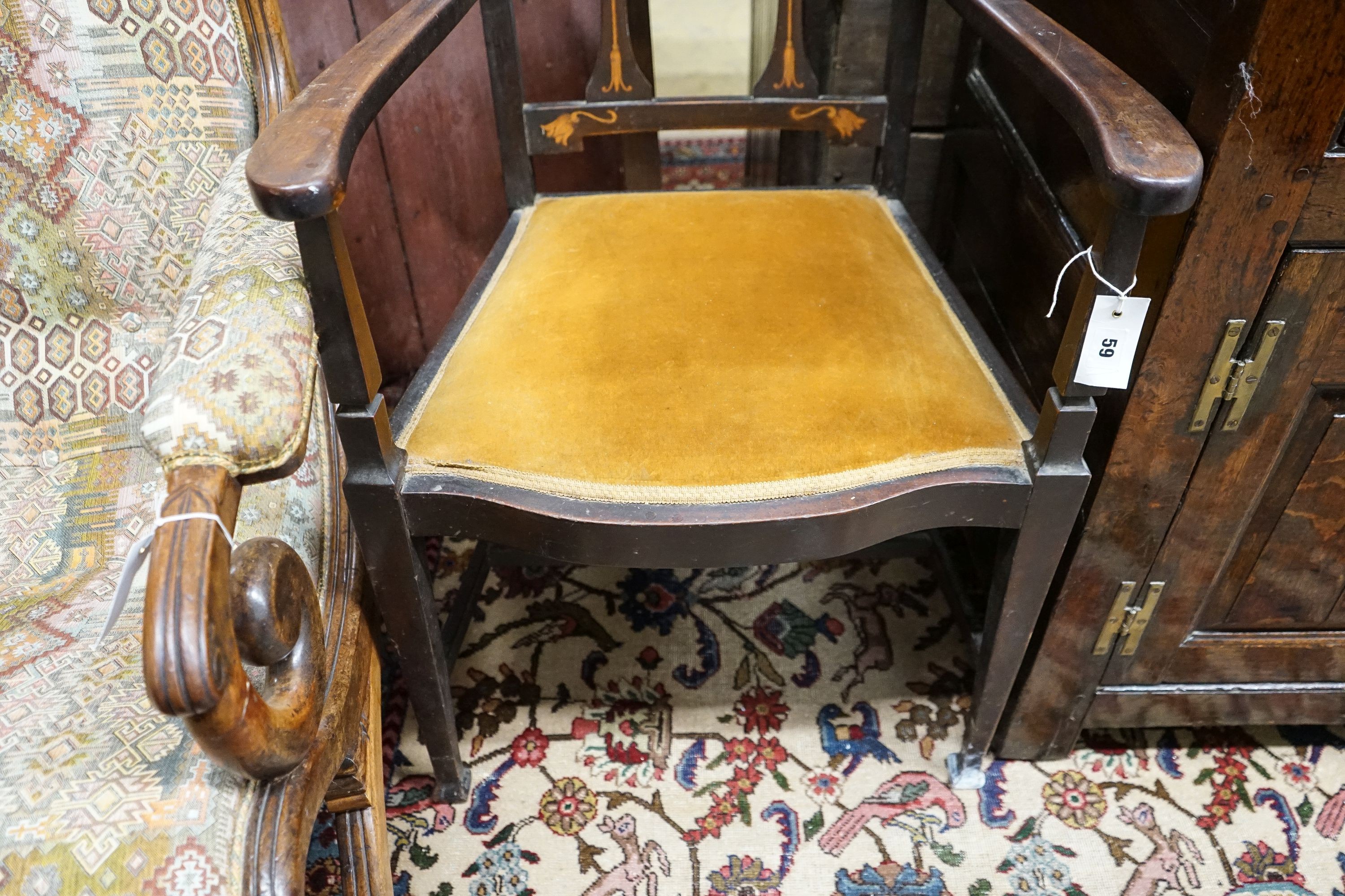 An Edwardian Art Nouveau inlaid mahogany elbow chair, width 59cm, depth 58cm, height 109cm
